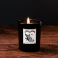 The Orangery Glass Candle by Chase and Wonder, elegant black glass vessel with gold lid