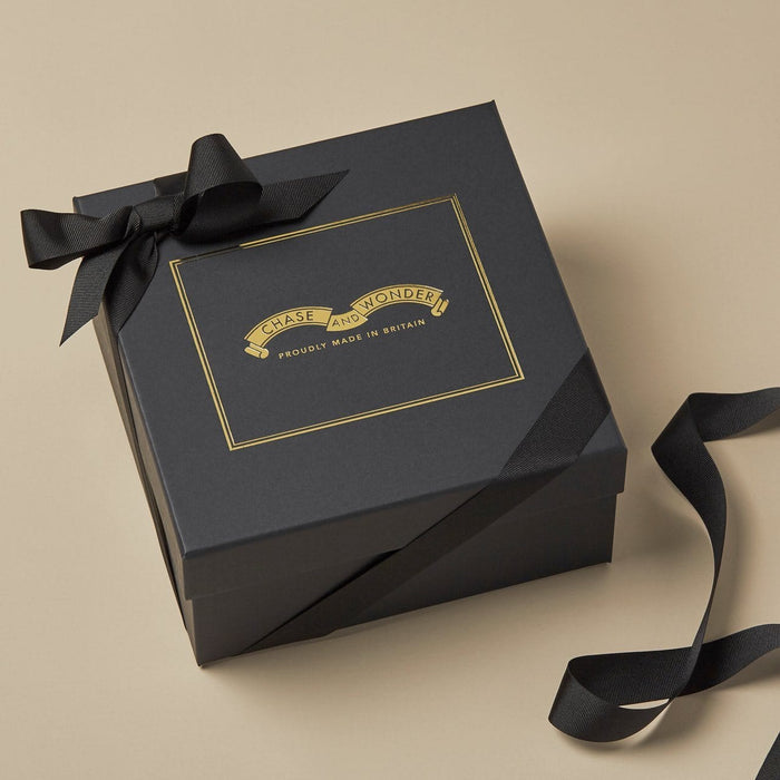 The Winter Fragrance Discovery Candle Set gift set, contents displayed alongside the luxury gift box