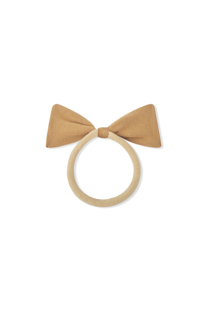 Tiny Nylon Bow in Ochre on a white background