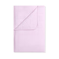 Folded light purple blanket on a white background