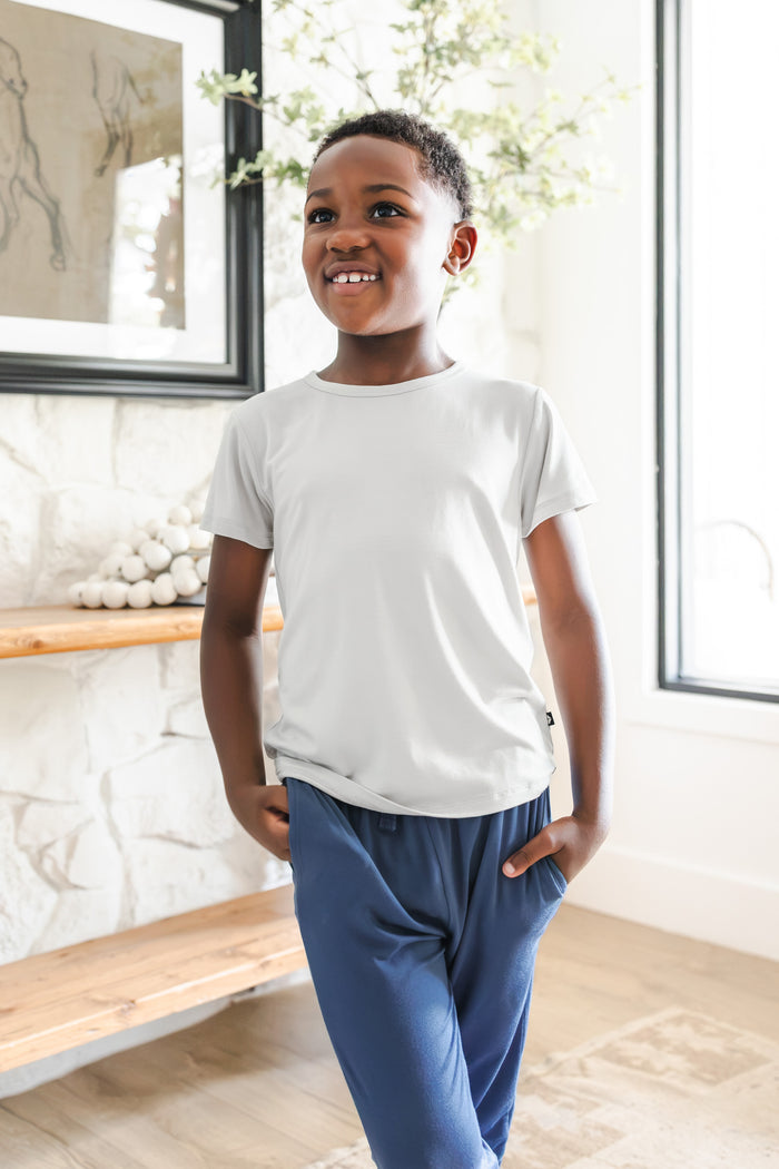 Toddler posing inToddler Jogger Pant in Oxford under white shirt standing in a room