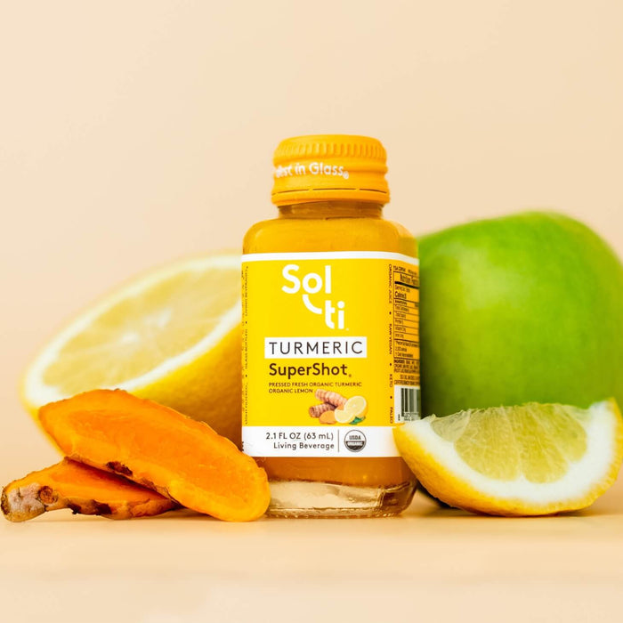 TURMERIC SuperShot glass bottle front label, with turmeric root, lemon slice and green apple