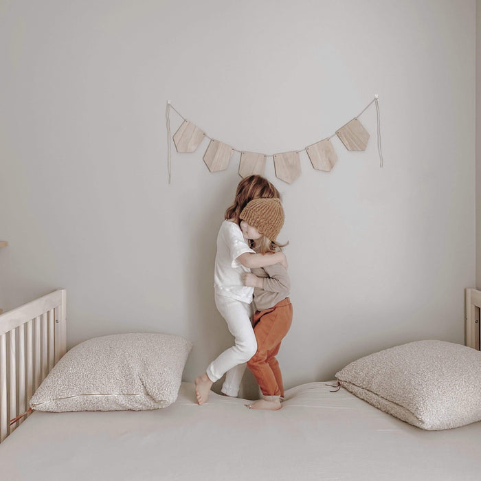 Bed with Kyte Baby Twin fitted sheet in  Oat