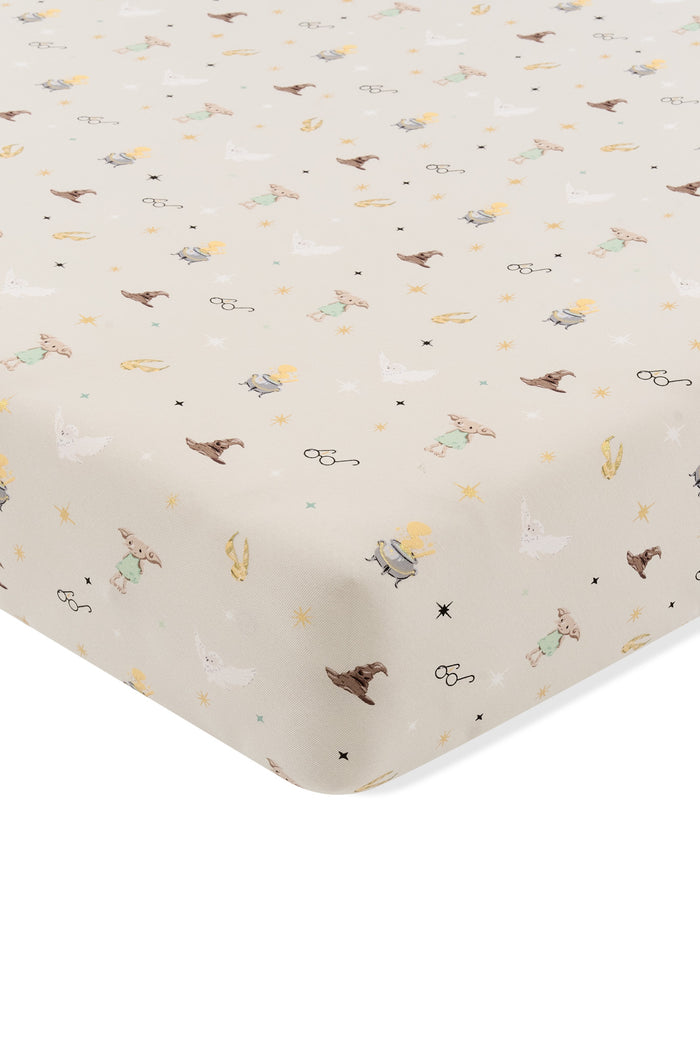 Beige Twin sheet with Harry Potter patten print on a white background