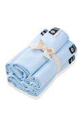 Bundle of Washcloth 5-Pack in Breeze shown in its packaging tied with a linen bow