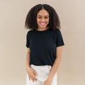 Woman modeling Women's Crew Neck Tee in Midnight