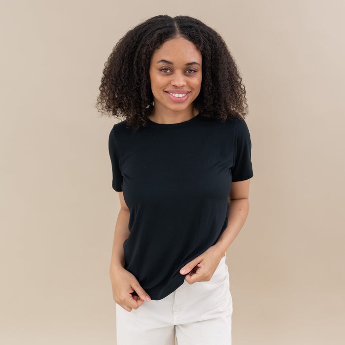 Woman modeling Women's Crew Neck Tee in Midnight