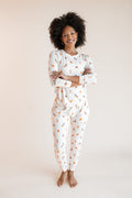 Modal wearing Women's Jogger Pajama Set in Halloween Teddy print on a beige background