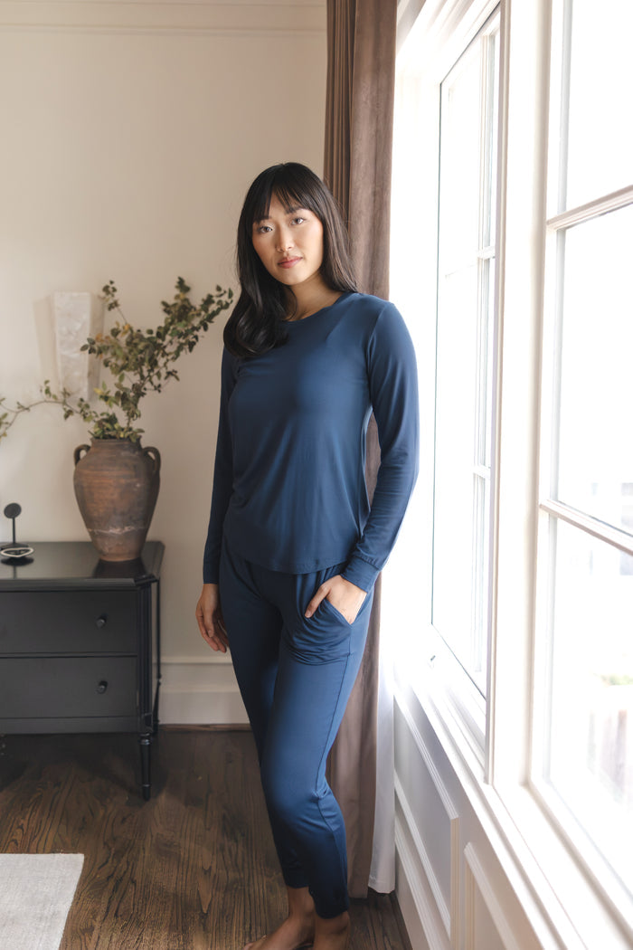 Modal wearing Women's Jogger Pajama Set in Oxford standing near a glass window