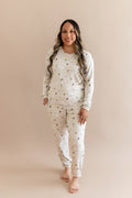 Women wearing a cream joggers set with Harry Potter prints on a beige background