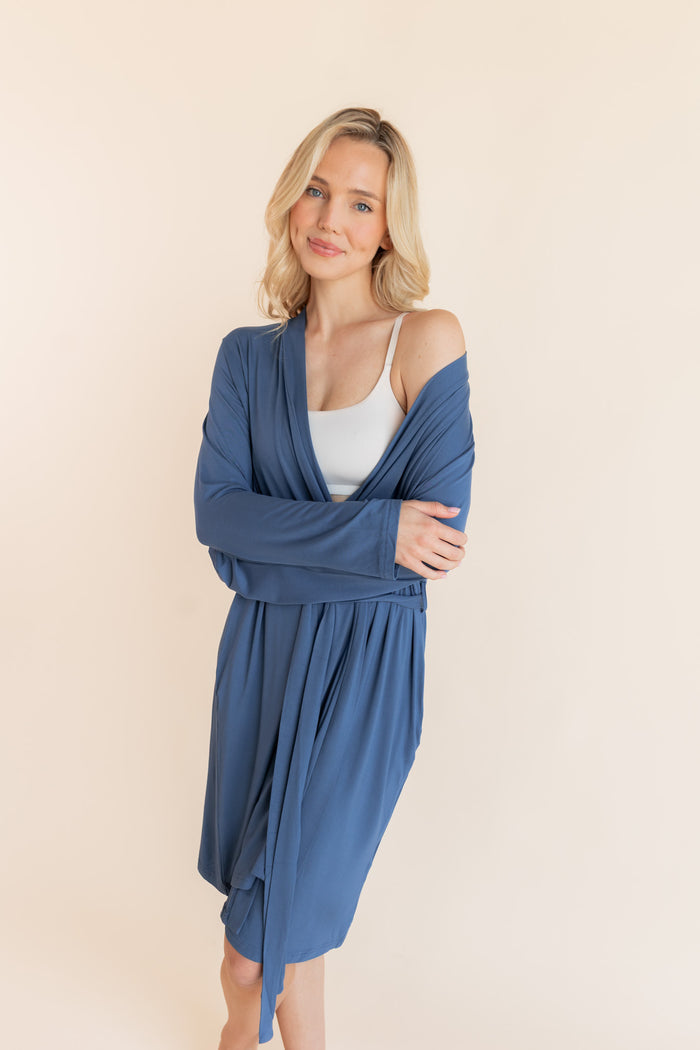 Model wearing Women's Lounge Robe in Oxford over white bralette on a beige background