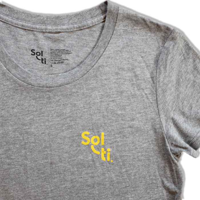 A gray organic cotton tee with the Sol-ti brand logo printed in orange on the front shown against a light background