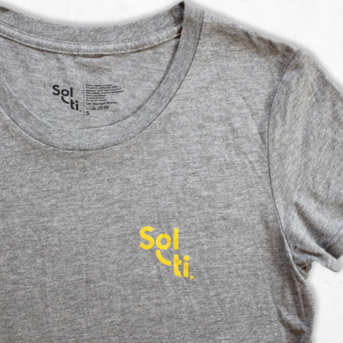 A gray organic cotton tee with the Sol-ti brand logo printed in orange on the front shown against a light background
