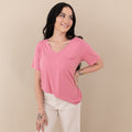 Woman wearing Kyte Baby Women's Relaxed Fit V-Neck in Apple Blossom