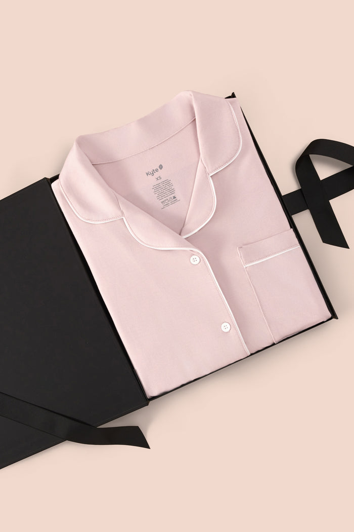 Women’s Short Sleeve Pajama Set in Blush with Cloud Trim packed in a box on a beige background
