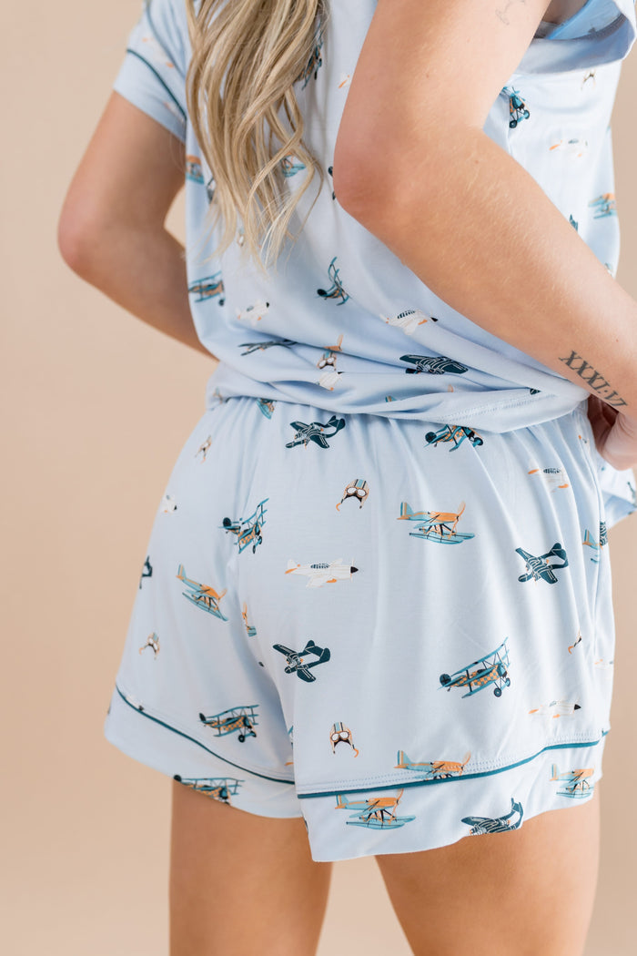 The back of the shorts of the Women's Short Sleeve Pajama Set in Take Off shown on a female model