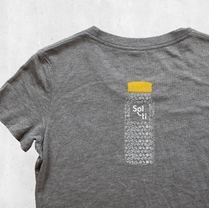 Youth Organic Cotton Tees, in gray with a design of a bottle filled with SuperFoods and a orange cap on the back shown against a light background