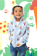 Boy wearing Zip-Up Hoodie in Curious George print over a blue jeans standing in front of a colorful background