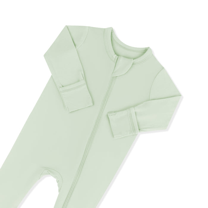 Close up of the zipper garage and fold over hand cuffs on the Zippered Footie in Basil