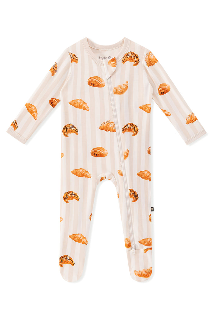 Zippered Footie in Croissant print on a white background
