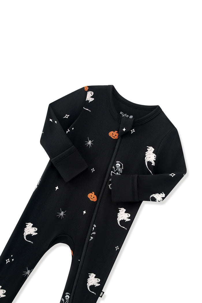 Black Zippered Footie in Halloween Friends print with zipper garage on a white background