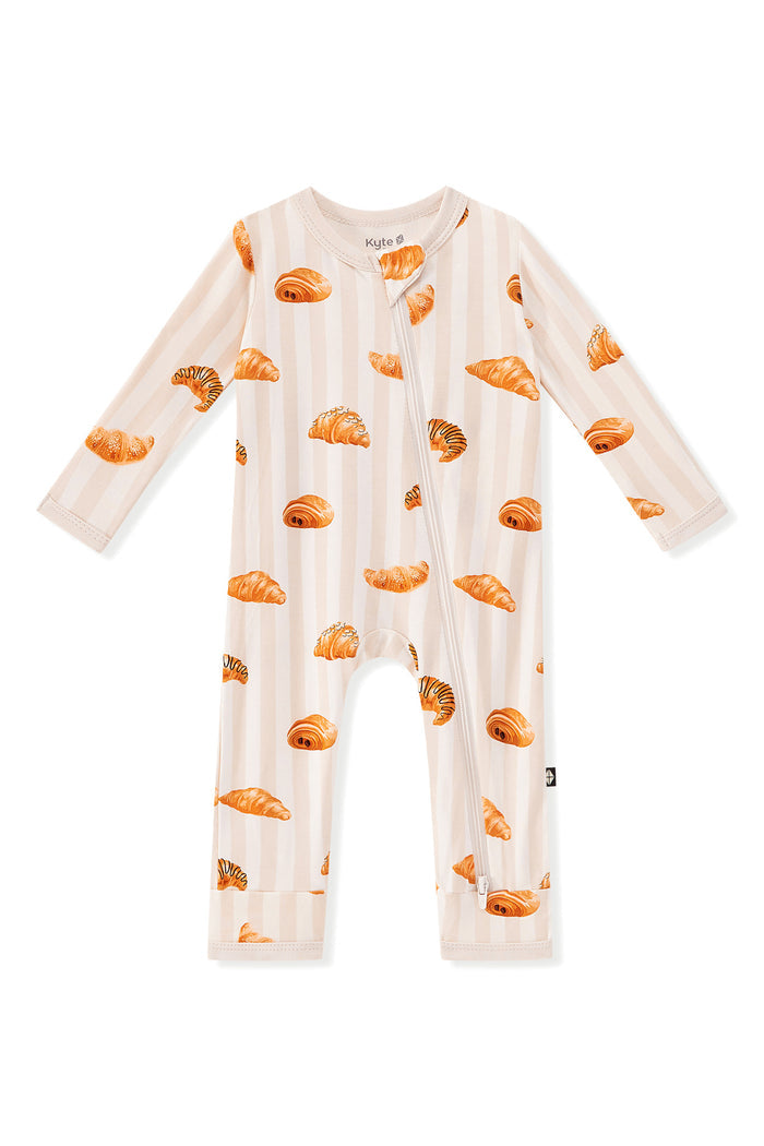Zippered Romper in Croissant print on a white background
