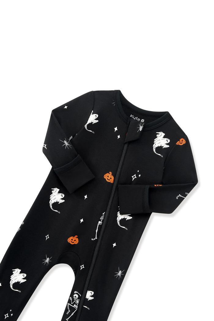 Black Zippered Romper in Halloween Friends print with zipper garage on a white background