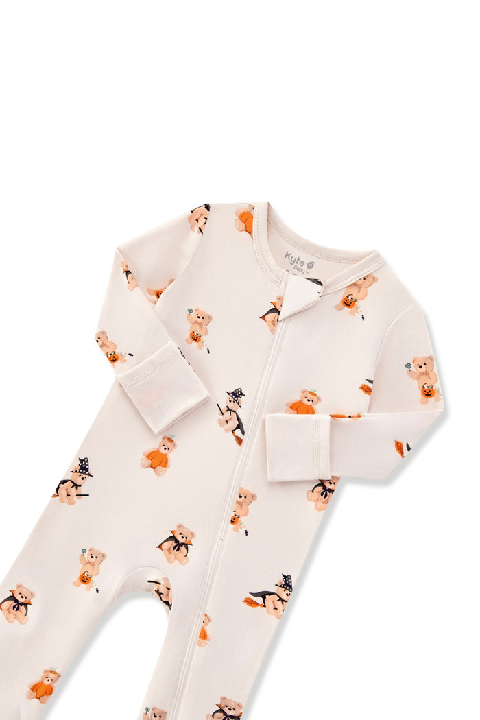 Beige Zippered Romper in Halloween Teddy print with zipper garage on a white background